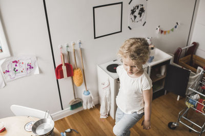 High angle view of girl walking in playroom at home