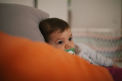 Close-up of cute baby sleeping at home