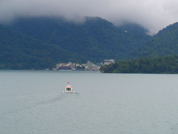 Boats sailing in sea