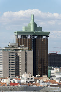 Buildings in city against sky