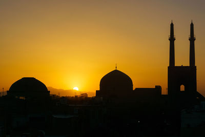 Silhouette mosque against sky during sunset