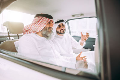 Men sitting in car