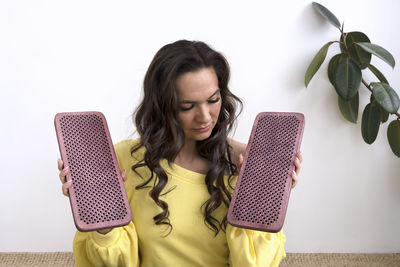 Portrait of young woman using mobile phone