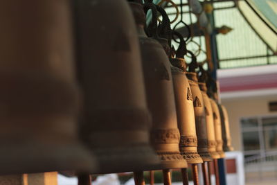 Close-up of metal hanging outside temple