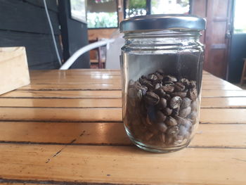 Close-up of coffee in jar on table