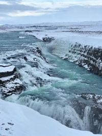 Scenic view of sea against sky during winter