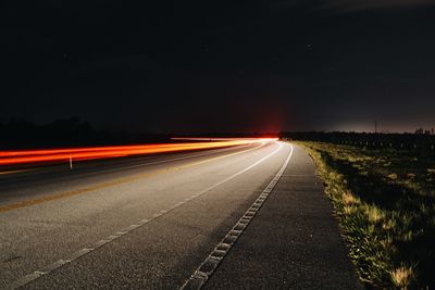 Light trails on road at night