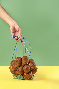 Close-up of hand holding ice cream