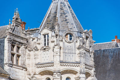 Low angle view of historic building against clear blue sky