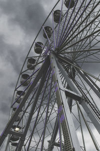 Low angle view of ferris wheel against sky