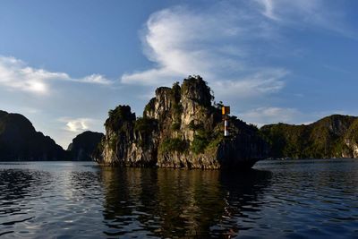Panoramic view of sea and rock formation against sky