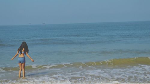 Woman playing on beach