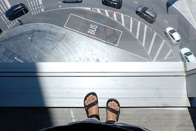 Low section of people standing on road