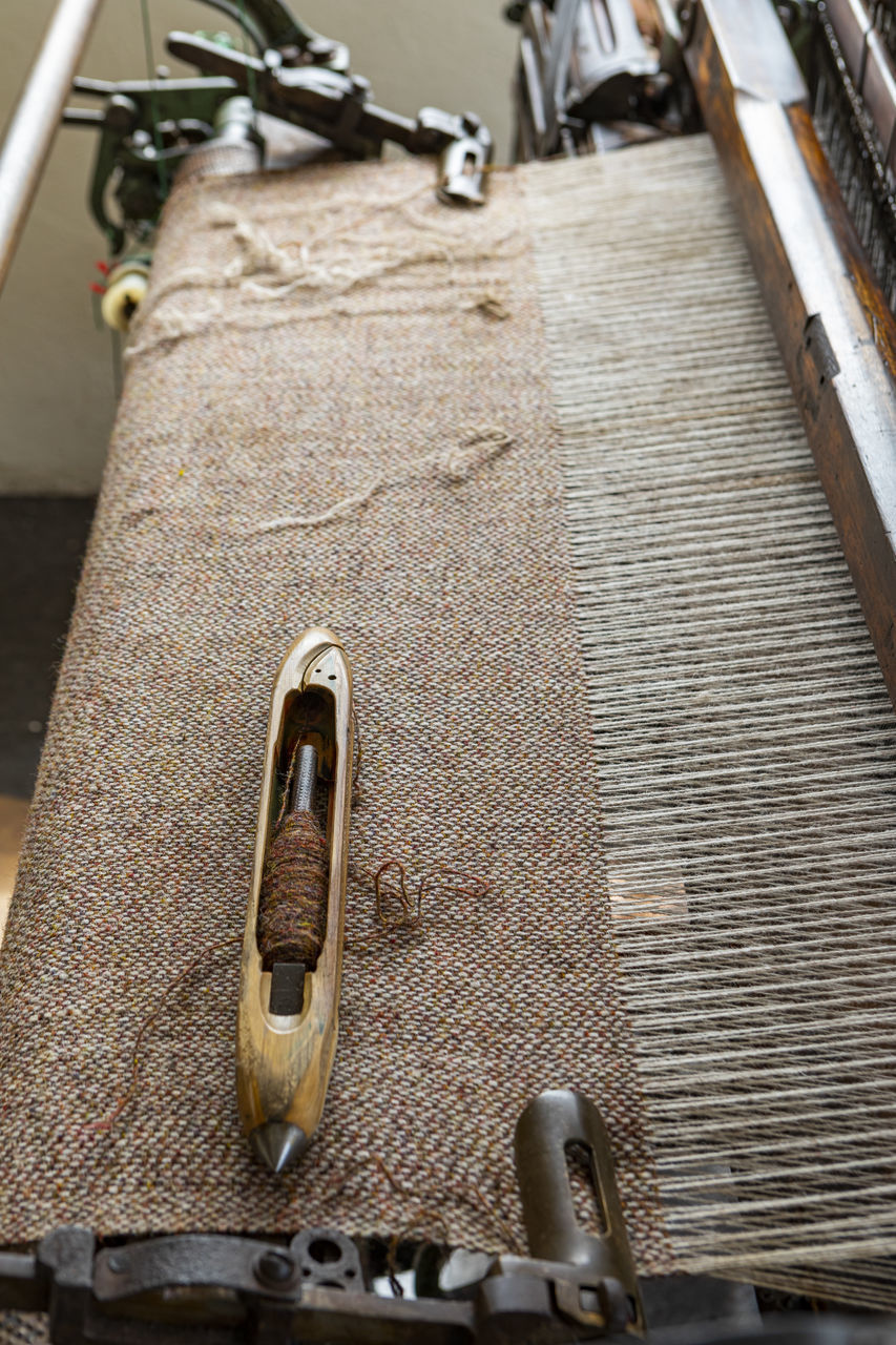 CLOSE-UP OF OLD MACHINE PART OF PIANO