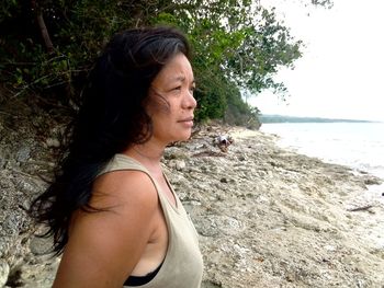 Side view of woman looking at beach