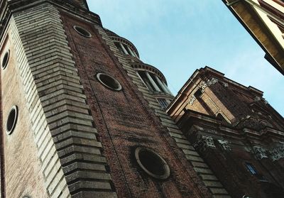 Low angle view of bell tower against sky