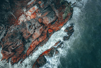 High angle view of rock formation in sea