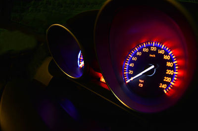 Close-up of illuminated speedometer in car