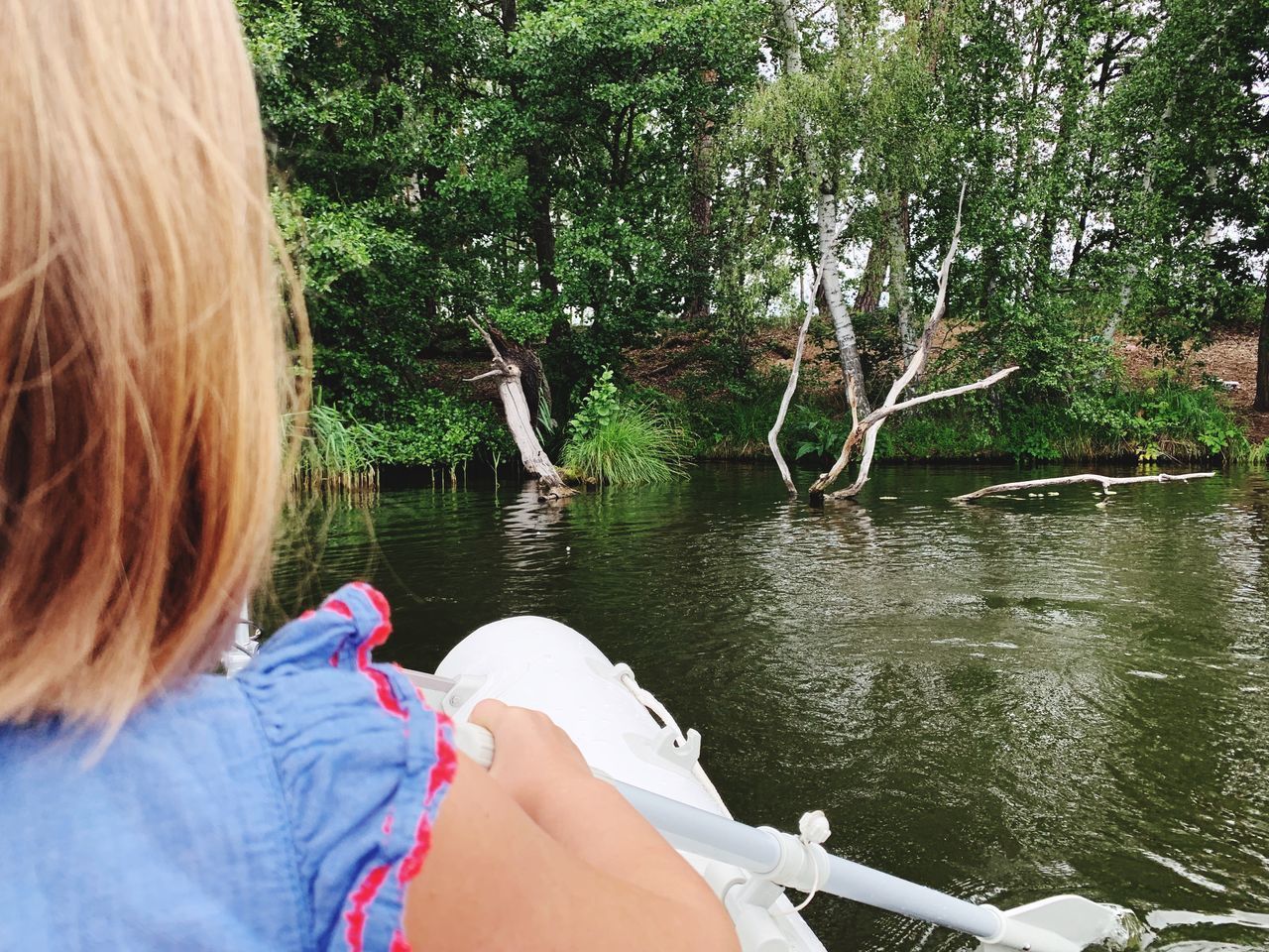 REAR VIEW OF WOMAN IN LAKE AMIDST TREES