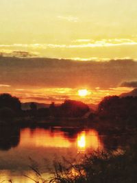 Scenic view of sunset over river