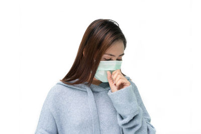 Portrait of a beautiful young woman over white background