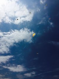 Low angle view of birds flying in sky