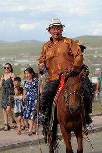 Portrait of people riding horse