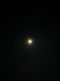 Low angle view of moon against sky at night