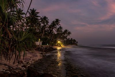 Scenic view of sea against sky at sunset