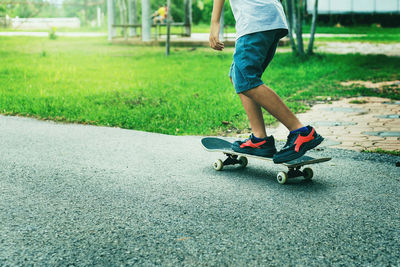 Low section of man skateboarding on skateboard