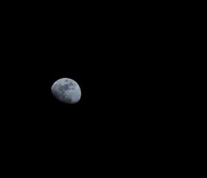 Low angle view of moon against clear sky at night