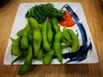 High angle view of vegetables in plate on table