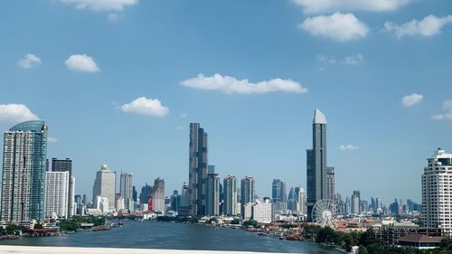 Modern buildings in city against sky