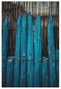 Close-up of blue wooden fence