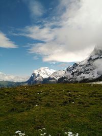 Scenic view of snowcapped mountains against sky