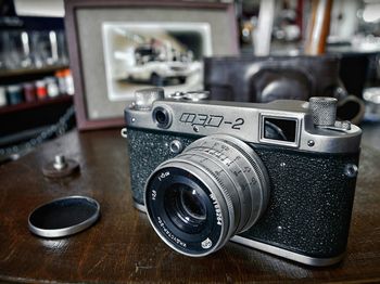 Close-up of camera on table