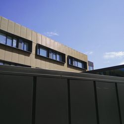 Low angle view of building against clear blue sky