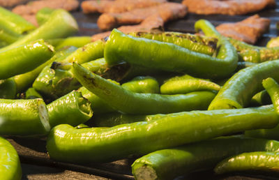 Close-up of green chili peppers for sale at market stall