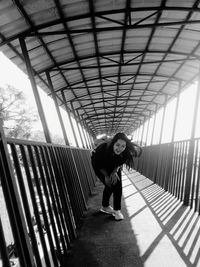 Man standing on bridge