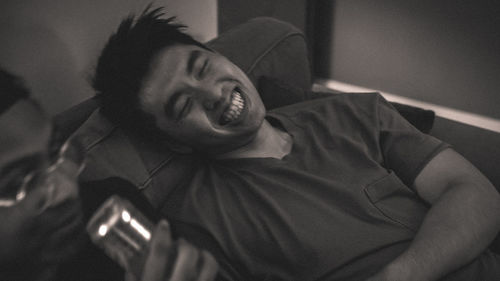 Portrait of young man at home