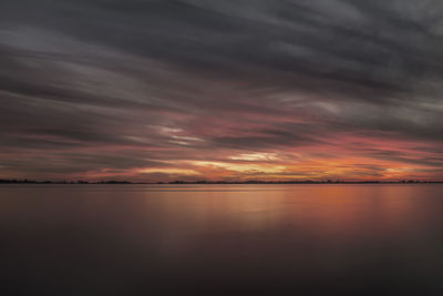 Dramatic sky over calm lake