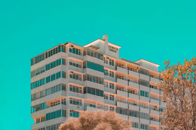 Low angle view of building against clear blue sky