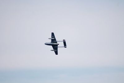 Low angle view of airplane flying in sky