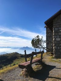 Old house on field against sky