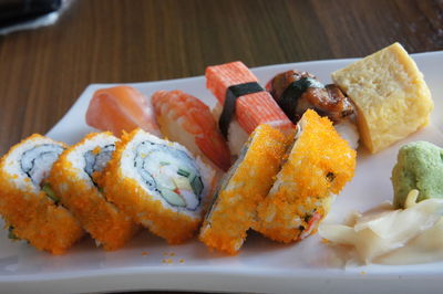 Close-up of sushi served on table