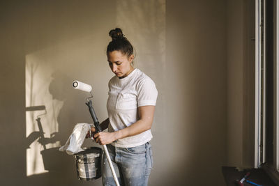 Woman painting room