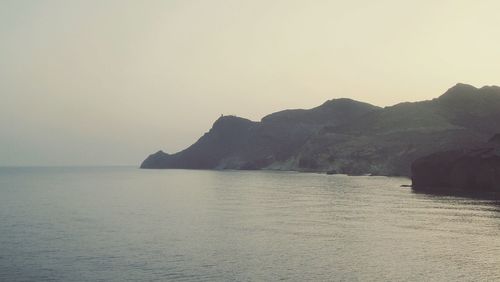 Scenic view of calm sea against clear sky
