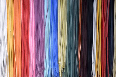 Full frame shot of colorful strings hanging in store