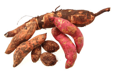 Directly above shot of carrots on white background