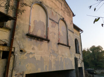 Low angle view of old building against sky